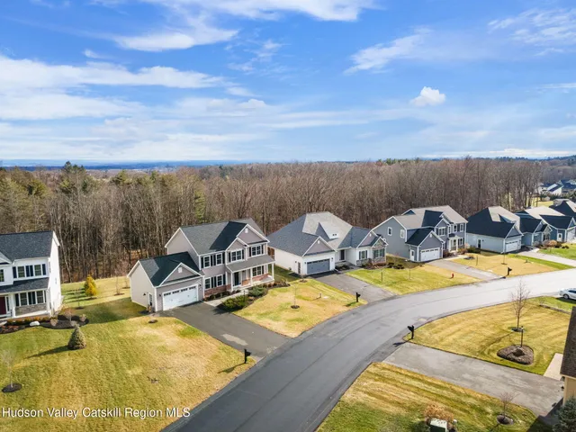 a view of a swimming pool with lounge chairs