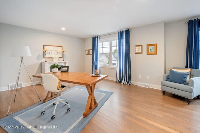 a room with furniture and a wooden floor