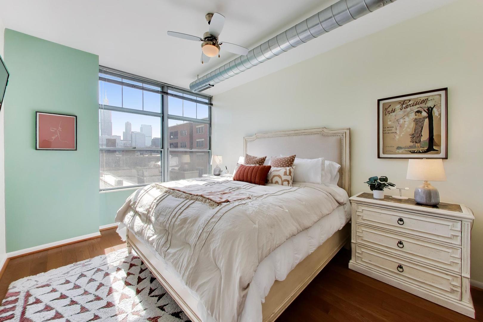 1200 West Monroe Street, Unit 502 Chicago, IL 60607 - Photo 12 of 34 a bedroom with a bed and a window