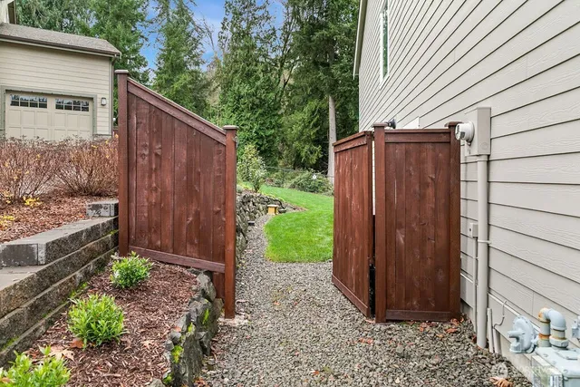 a view of a house with a backyard