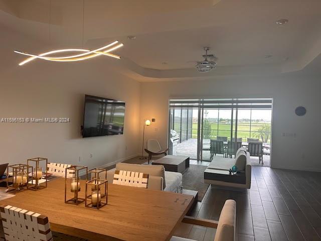 5545 Hampton Links Court, Unit 5545 Ave Maria, FL 34142 - Photo 11 of 28 a living room with furniture and wooden floor