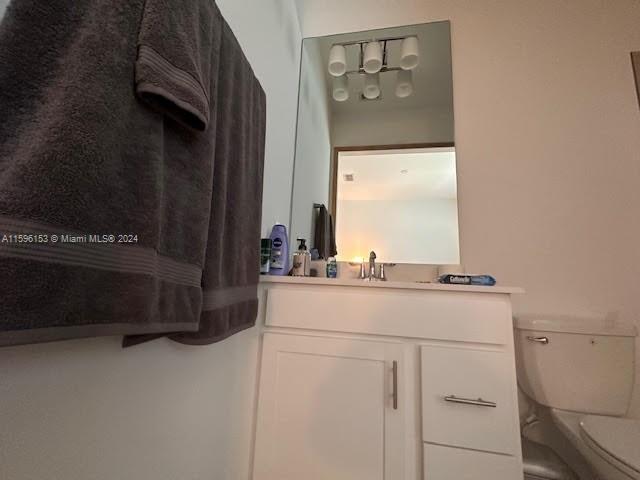 5545 Hampton Links Court, Unit 5545 Ave Maria, FL 34142 - Photo 19 of 28 a bathroom with a sink and a mirror