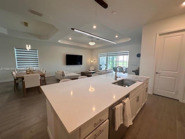5545 Hampton Links Court, Unit 5545 Ave Maria, FL 34142 - Photo 4 of 28 a large white kitchen with a sink and a large window