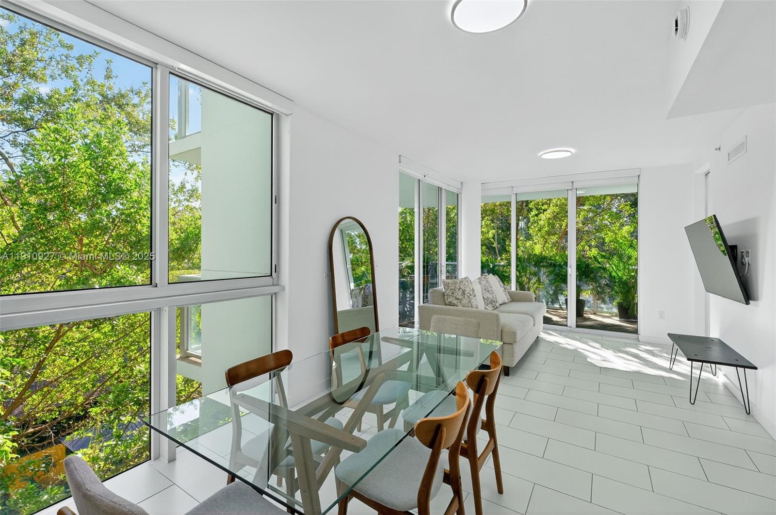 a view of a dining room with furniture window and outside view