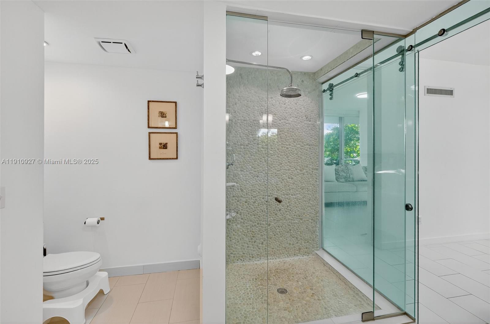 720 Northeast 62nd Street, Unit 311 Miami, FL 33138 - Photo 17 of 39 a bathroom with a shower a toilet and sink