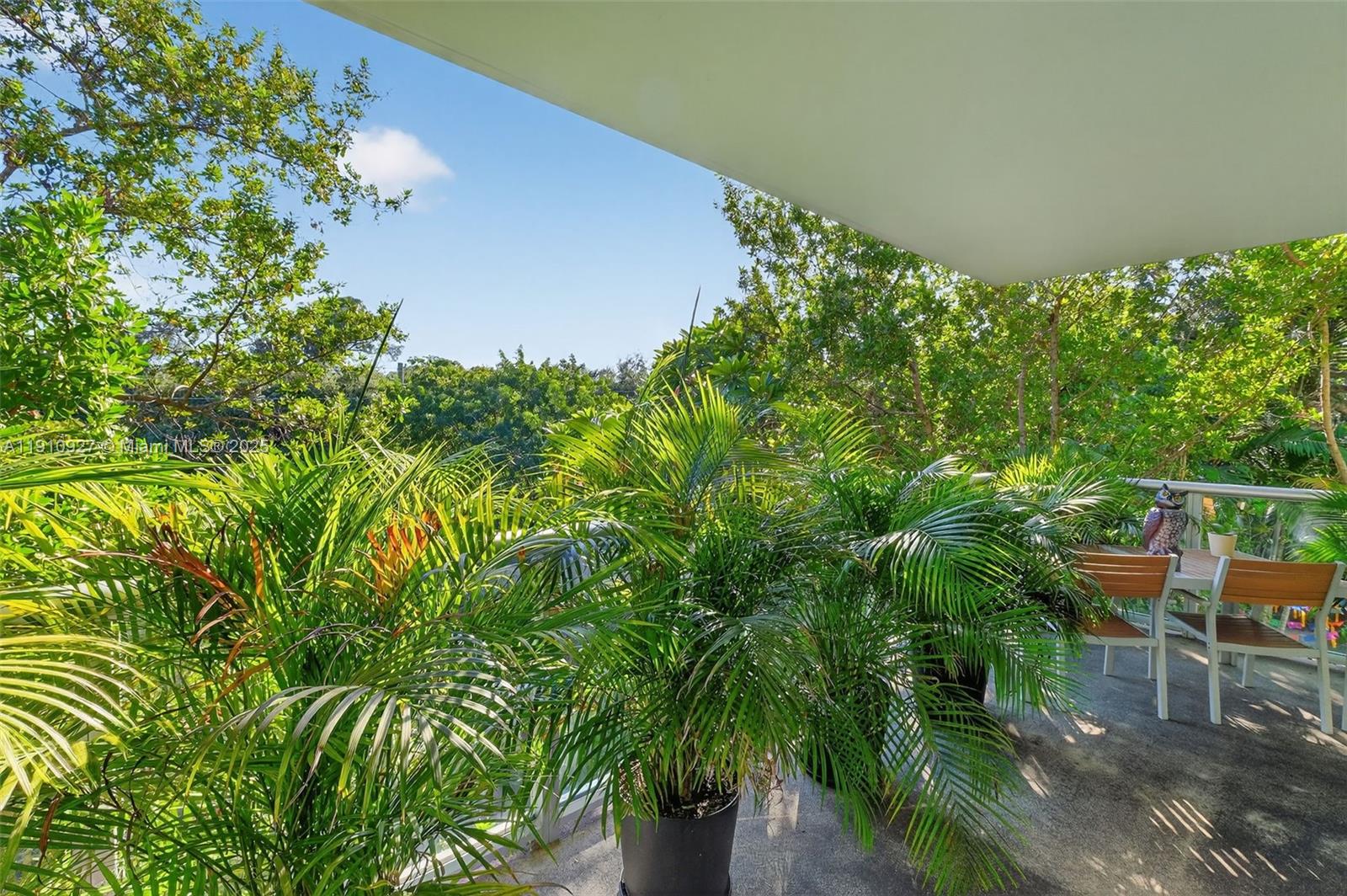 720 Northeast 62nd Street, Unit 311 Miami, FL 33138 - Photo 32 of 39 a backyard of a house with lots of green space and seating area