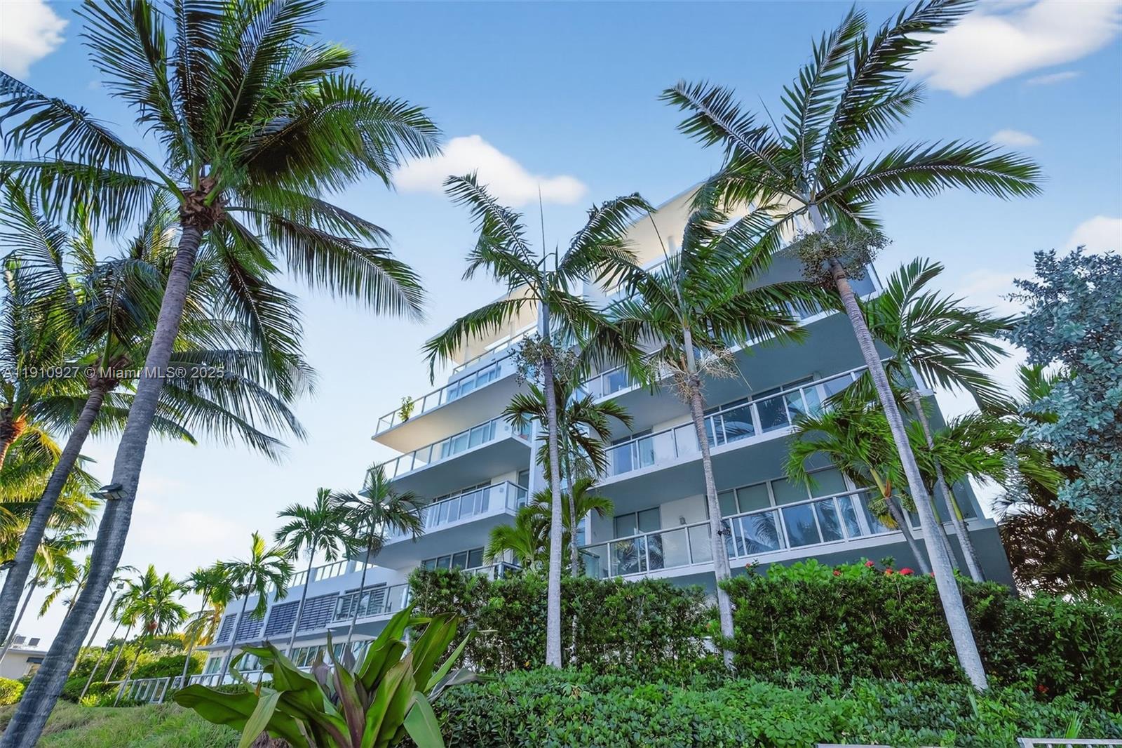 720 Northeast 62nd Street, Unit 311 Miami, FL 33138 - Photo 38 of 39 a view of a palm trees in front of a house
