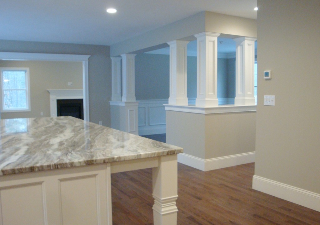 6 Keyes Hill Road Hollis, NH 03049 - Photo 5 of 13 an empty room with wooden floor and fireplace