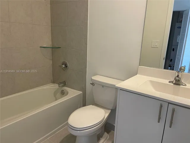 a bathroom with a sink a toilet and bathtub
