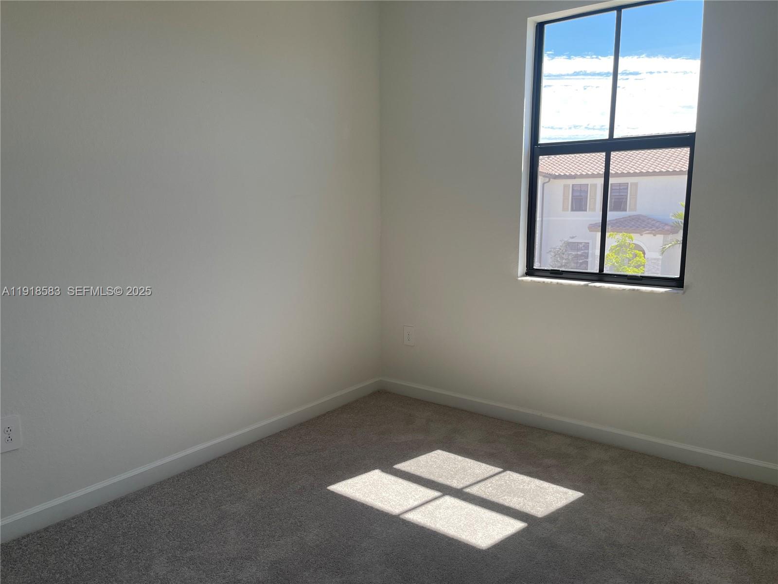 11745 Southwest 245 Terrace Homestead, FL 33032 - Photo 6 of 15 an empty room with windows