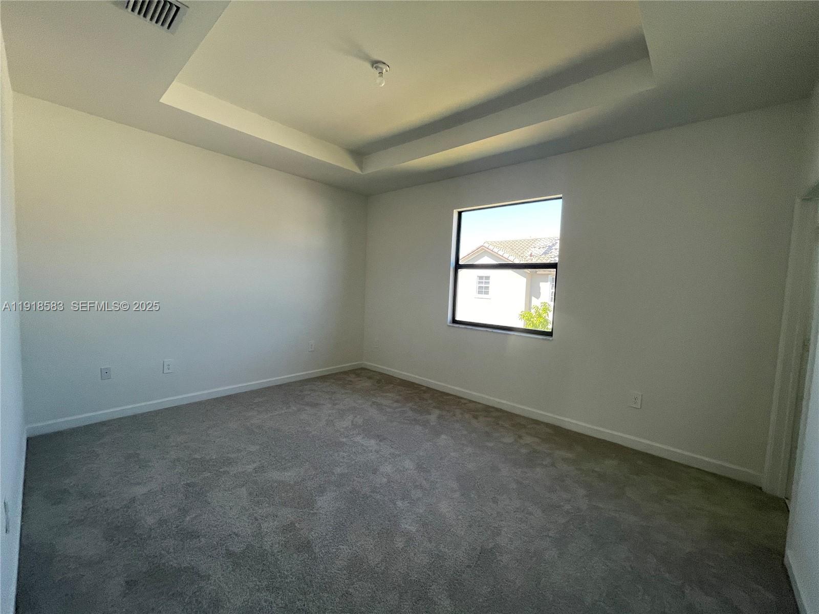 11745 Southwest 245 Terrace Homestead, FL 33032 - Photo 8 of 15 an empty room with a window