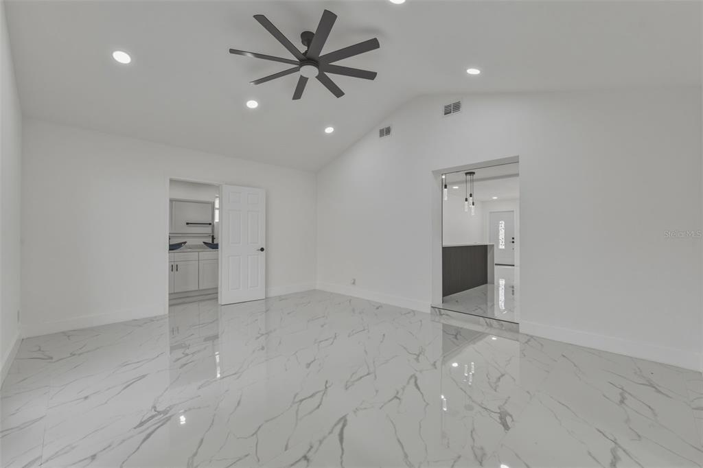 1413 May Street Lutz, FL 33548 - Photo 14 of 43 an empty room with a empty space and windows