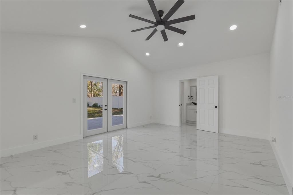 1413 May Street Lutz, FL 33548 - Photo 15 of 43 a view of an empty room with a fan