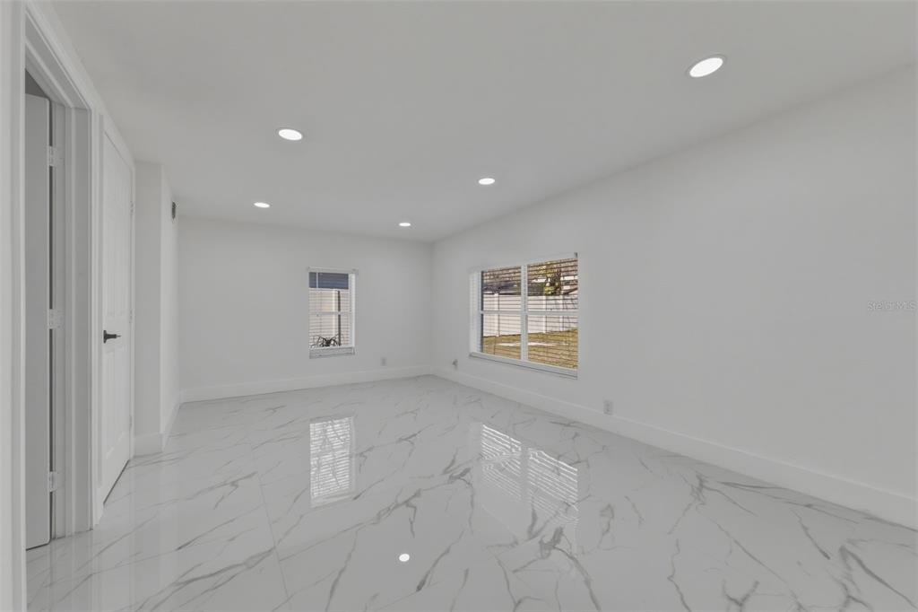 1413 May Street Lutz, FL 33548 - Photo 18 of 43 a view of an empty room with a window