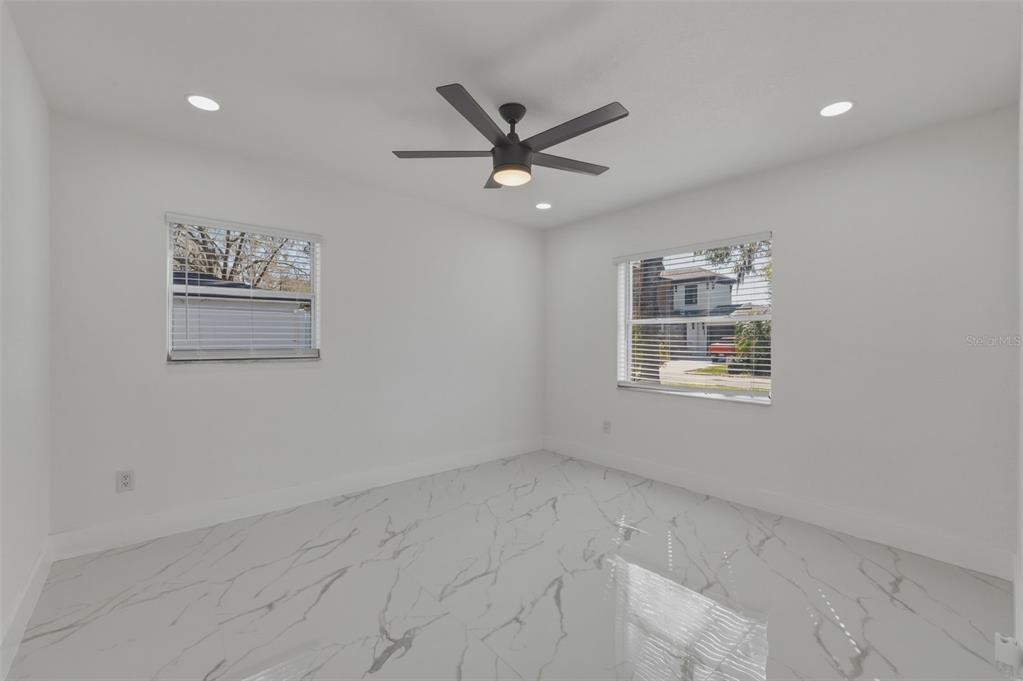 1413 May Street Lutz, FL 33548 - Photo 22 of 43 a view of a livingroom with a ceiling fan and window