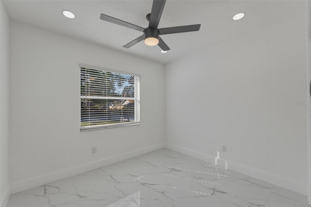 1413 May Street Lutz, FL 33548 - Photo 23 of 43 a view of an empty room with a window