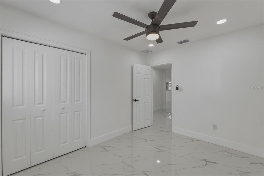 1413 May Street Lutz, FL 33548 - Photo 24 of 43 wooden floor in an empty room