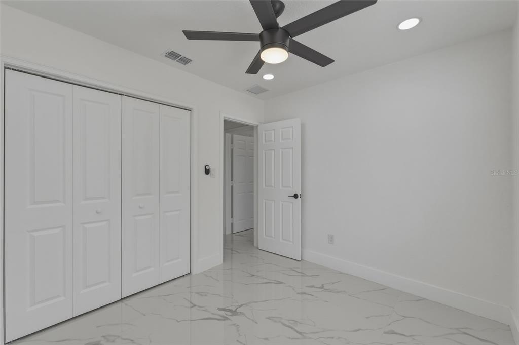 1413 May Street Lutz, FL 33548 - Photo 25 of 43 wooden floor in an empty room