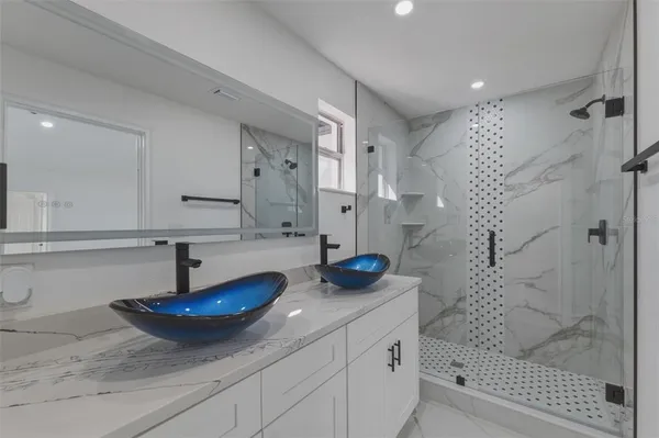 a bathroom with a sink and a mirror
