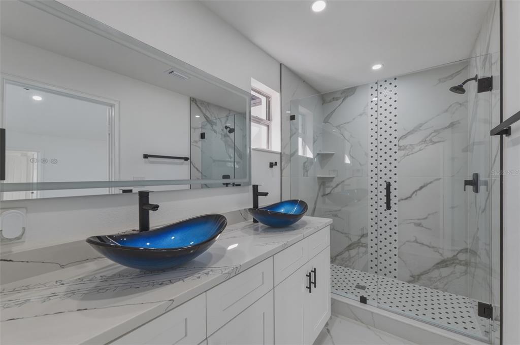 1413 May Street Lutz, FL 33548 - Photo 28 of 43 a bathroom with a sink and a mirror