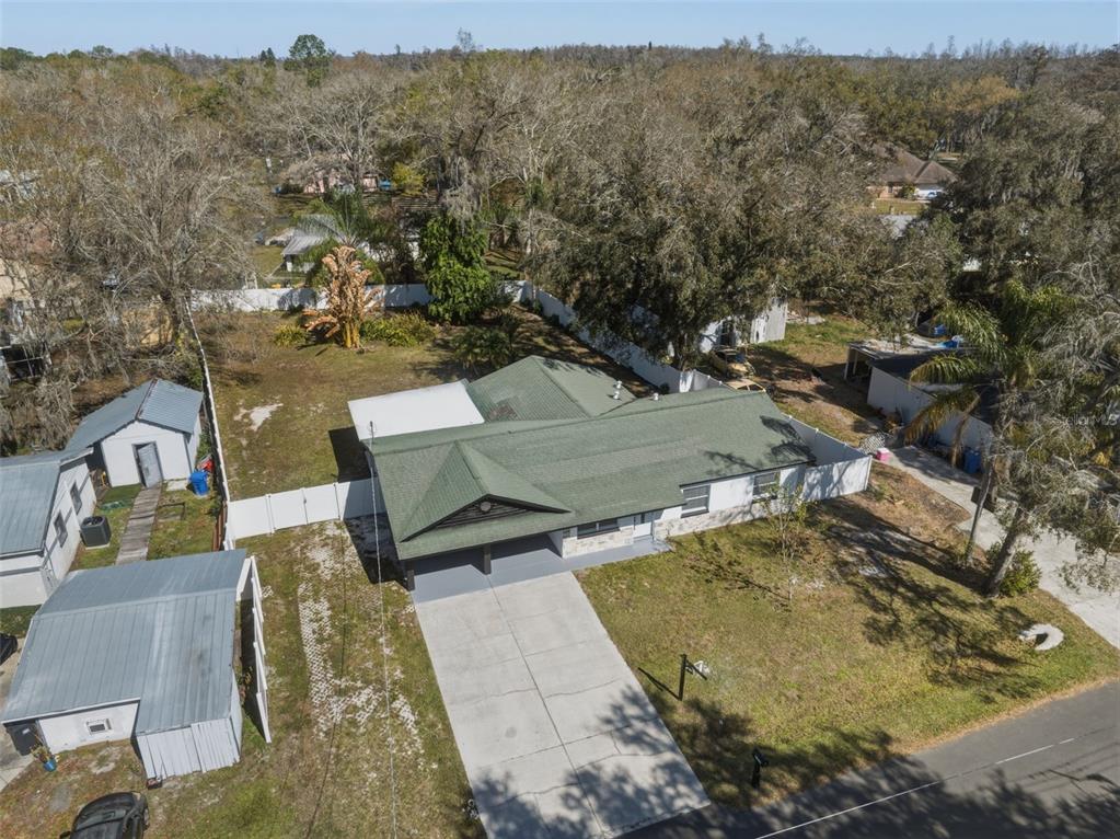 1413 May Street Lutz, FL 33548 - Photo 30 of 43 an aerial view of a house with a yard