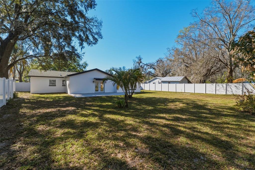 1413 May Street Lutz, FL 33548 - Photo 31 of 43 a view of a house with a yard