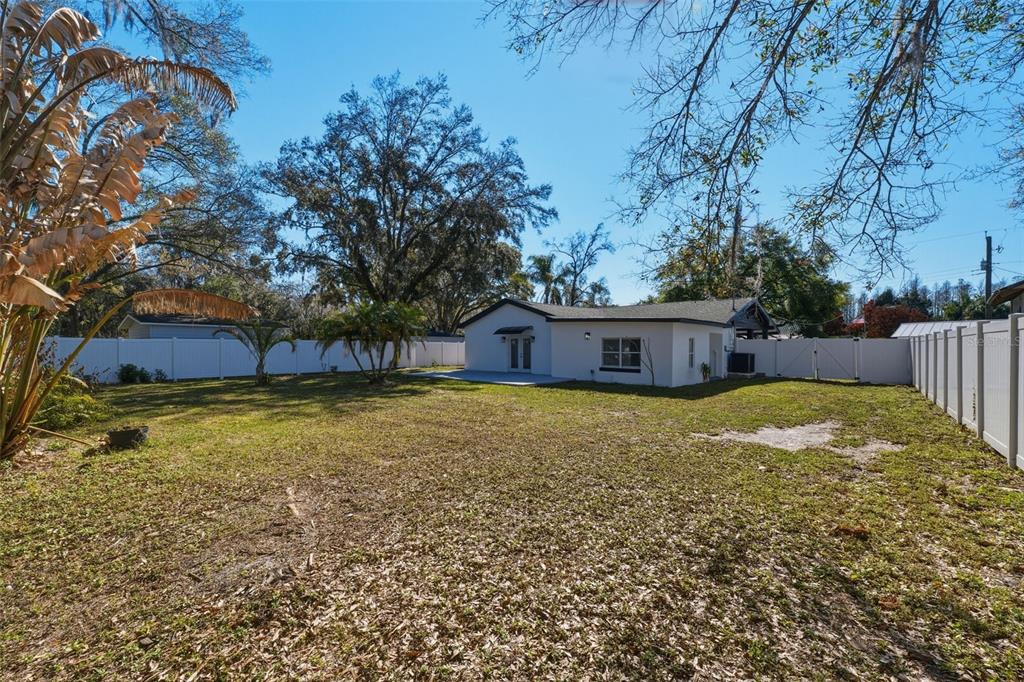 1413 May Street Lutz, FL 33548 - Photo 32 of 43 a view of house with outdoor space