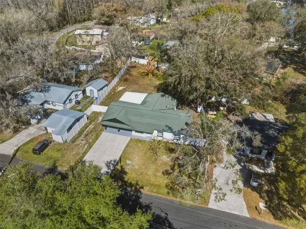 an aerial view of residential house with outdoor space