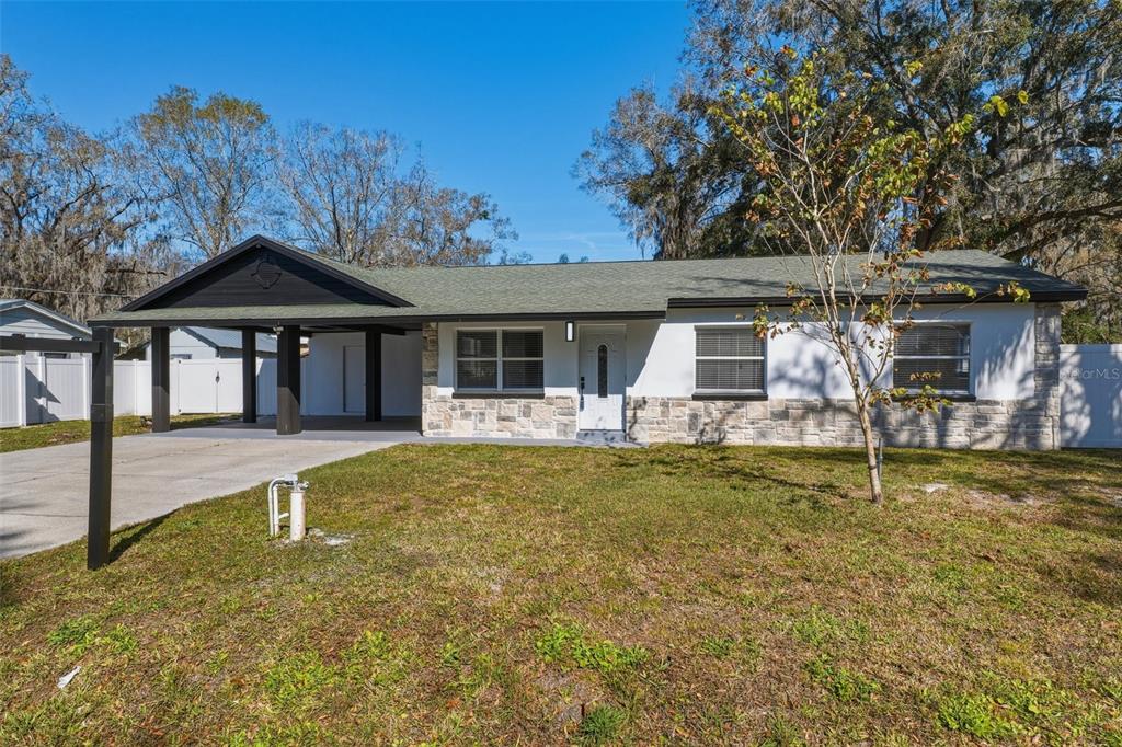 1413 May Street Lutz, FL 33548 - Photo 4 of 43 a house with swimming pool in front of it
