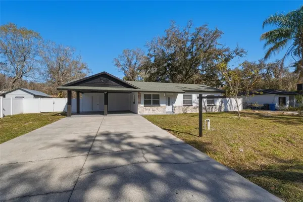 a front view of a house with swimming pool