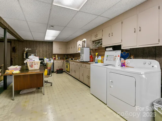 a view of room with furniture and a chandelier