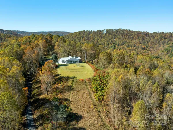a house with trees in the background