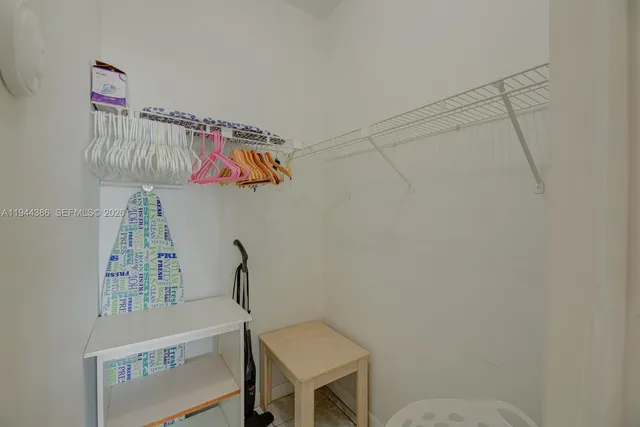 a dining room with furniture and a flat screen tv