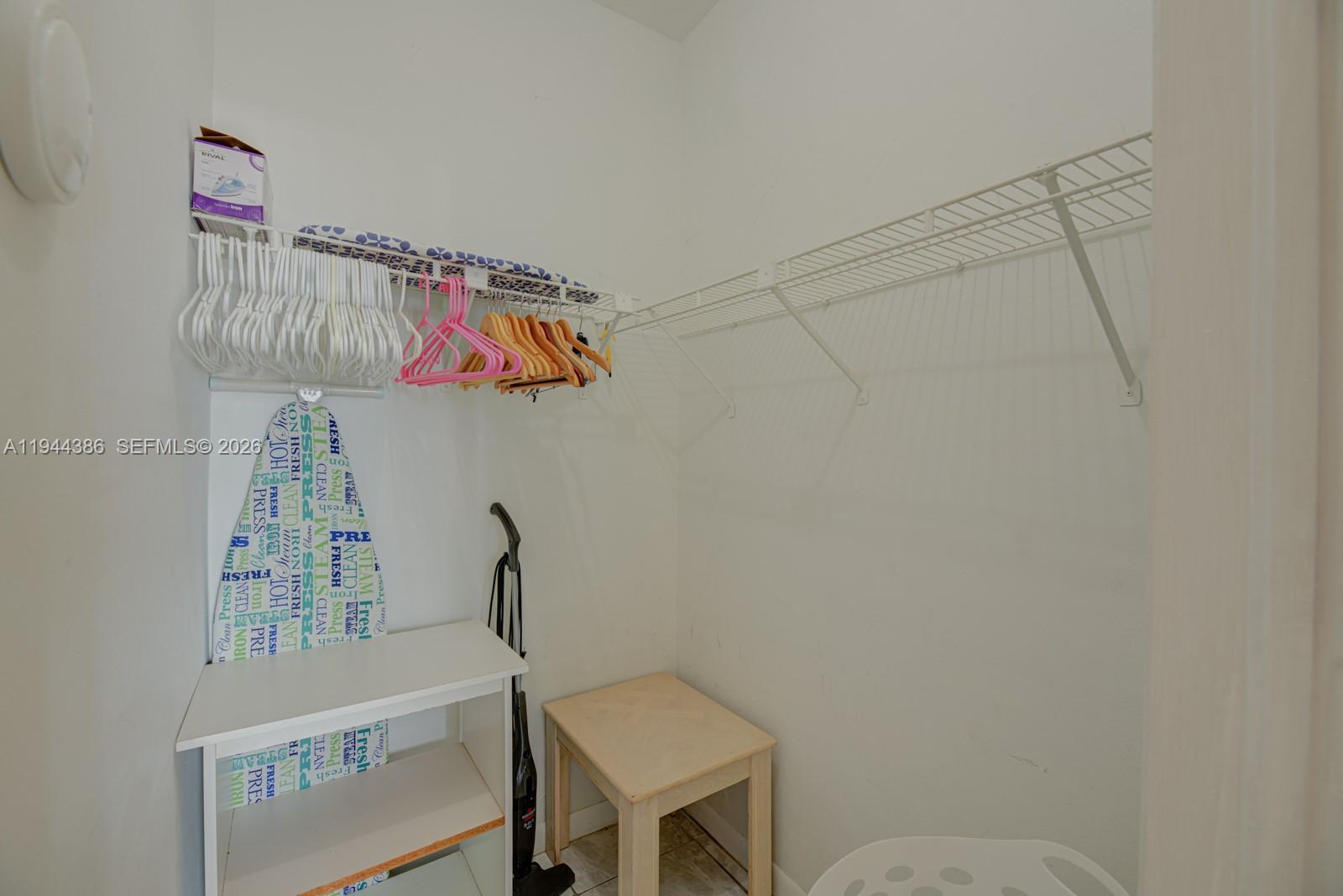 326 Harrison Street, Unit 106A Hollywood, FL 33019 - Photo 15 of 22 a bathroom with a sink a toilet and a window