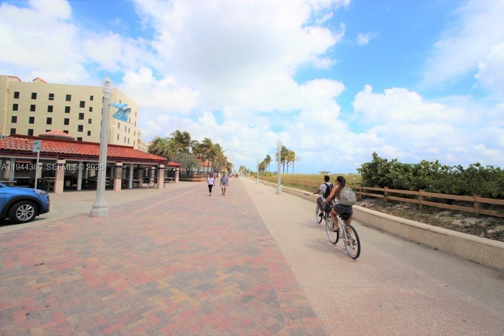 326 Harrison Street, Unit 106A Hollywood, FL 33019 - Photo 6 of 22 a view of a lake with a yard