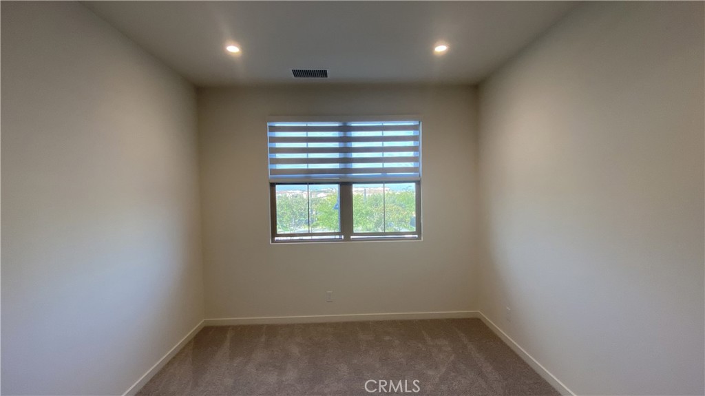110 Sunnyside Irvine, CA 92618 - Photo 13 of 30 an empty room with a window