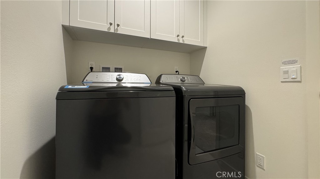 110 Sunnyside Irvine, CA 92618 - Photo 15 of 30 a utility room with dryer and washer
