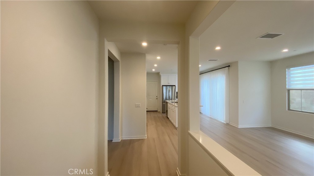 110 Sunnyside Irvine, CA 92618 - Photo 4 of 30 a view of hallway with wooden floor