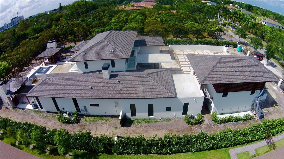 9000 Southwest 63rd Court Pinecrest, FL 33156 - Photo 12 of 26 an aerial view of a house with yard and patio