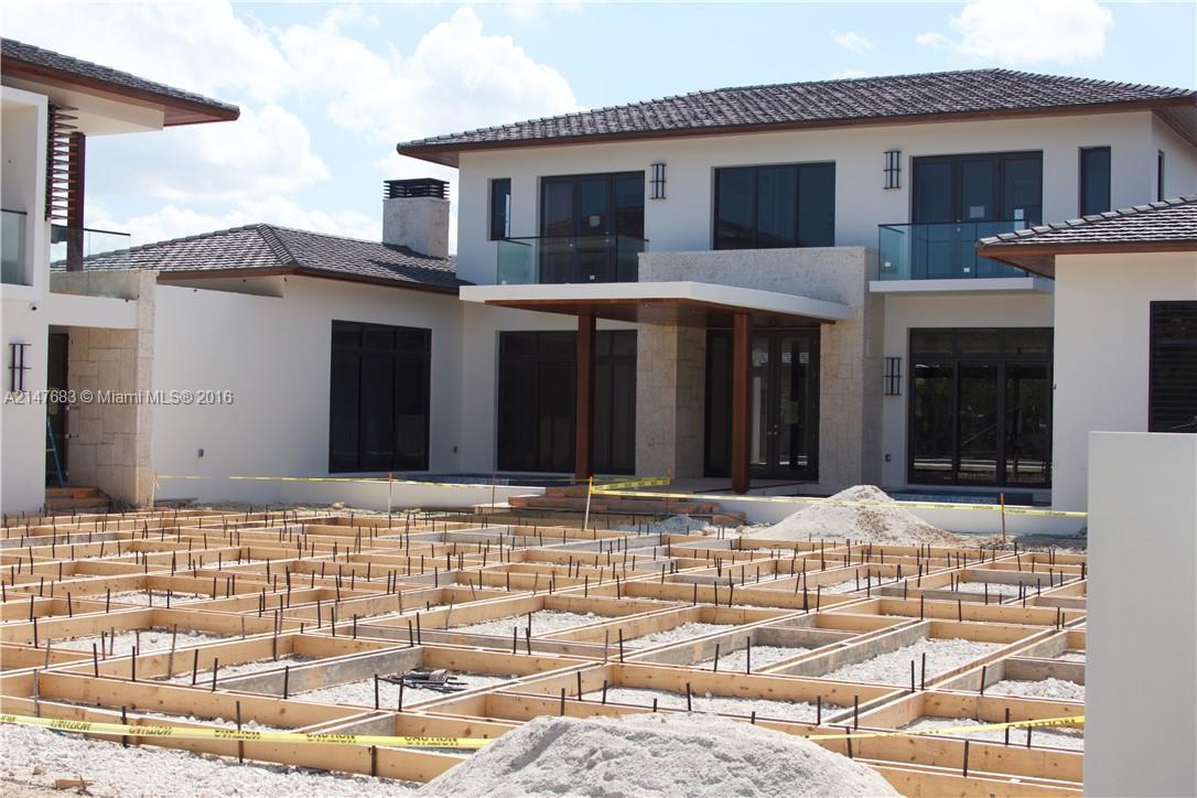 9000 Southwest 63rd Court Pinecrest, FL 33156 - Photo 14 of 26 a house with yard in front of it