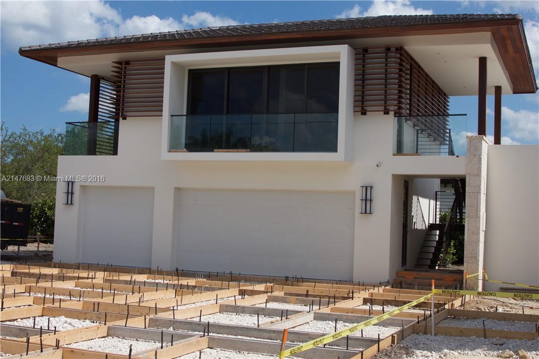 9000 Southwest 63rd Court Pinecrest, FL 33156 - Photo 16 of 26 a front view of a house