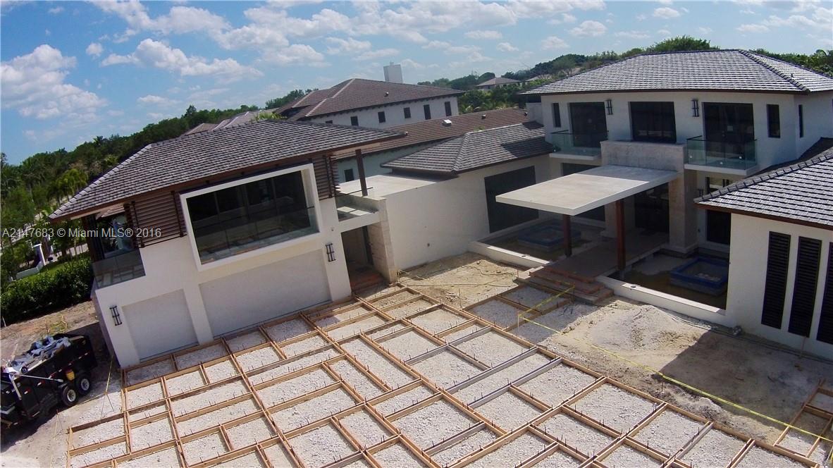 9000 Southwest 63rd Court Pinecrest, FL 33156 - Photo 17 of 26 a view of a patio with table and chairs with wooden floor and fence