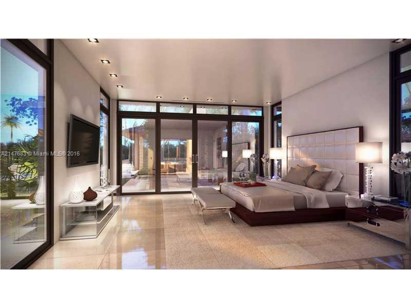 9000 Southwest 63rd Court Pinecrest, FL 33156 - Photo 9 of 26 a living room with furniture and large windows
