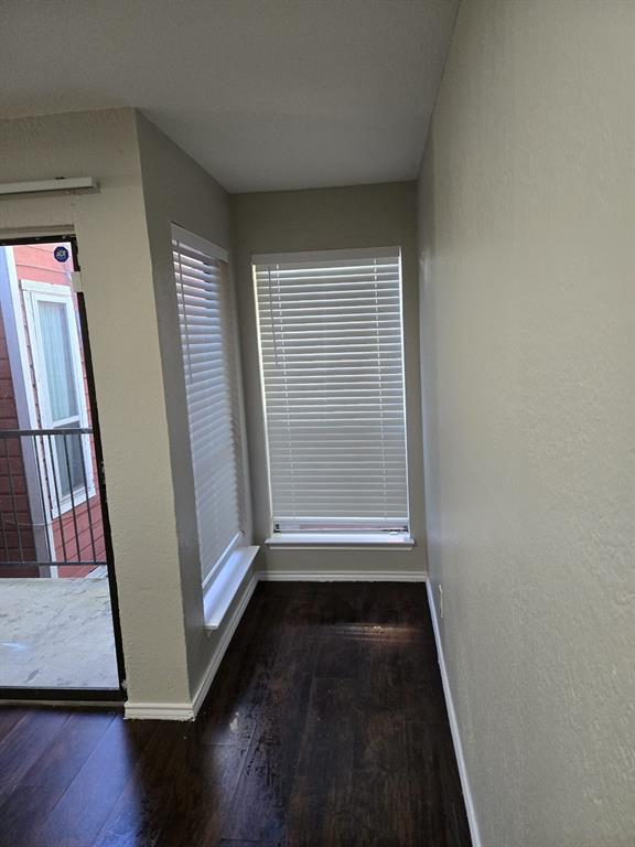 9821 Walnut Street, Unit 304 Dallas, TX 75243 - Photo 14 of 15 an entryway with wooden floor and door