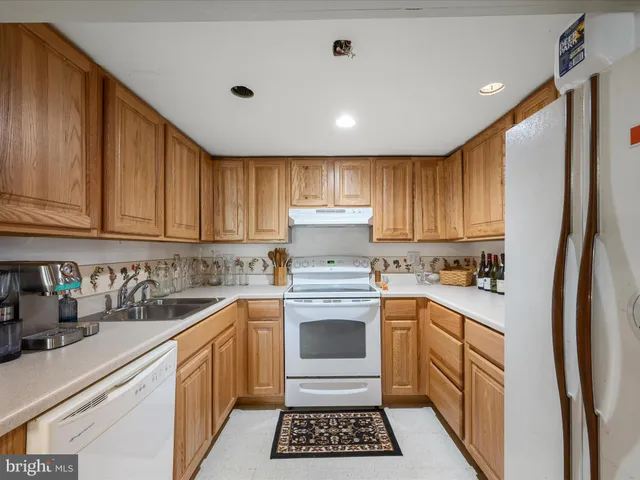 a kitchen with lots of counter top space and cabinets