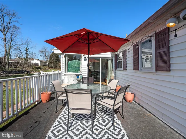 a view of backyard with swimming pool