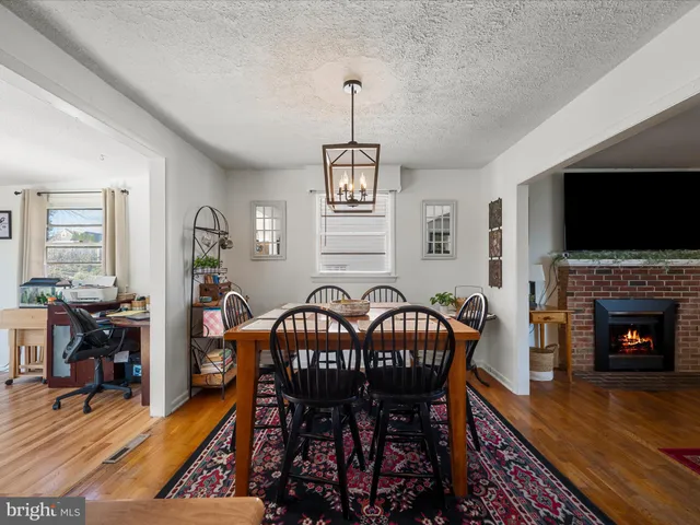 a view of a livingroom with furniture window and wooden floor