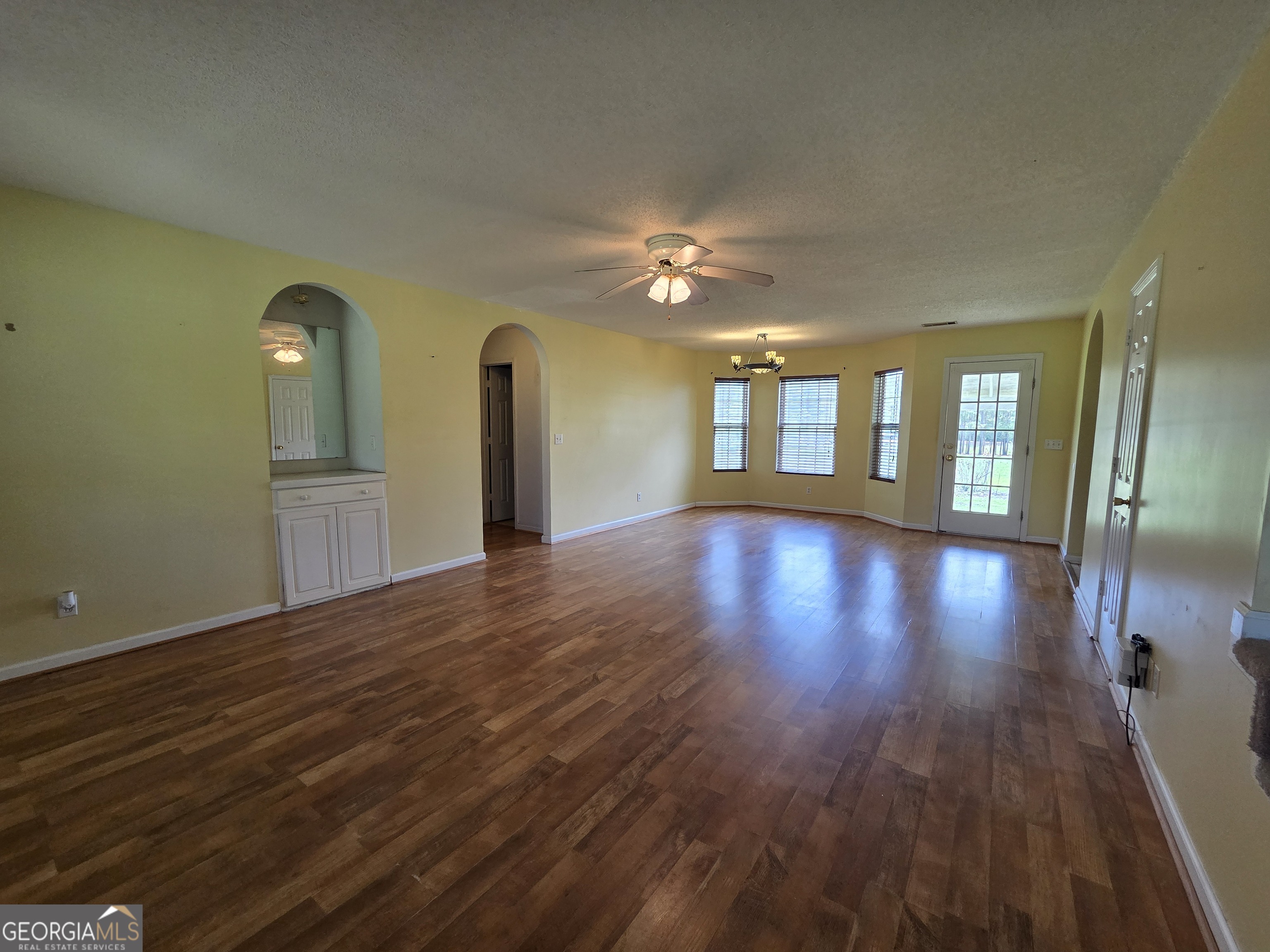 9546 Union Road Metter, GA 30439 - Photo 7 of 45 wooden floor in an empty room with a window
