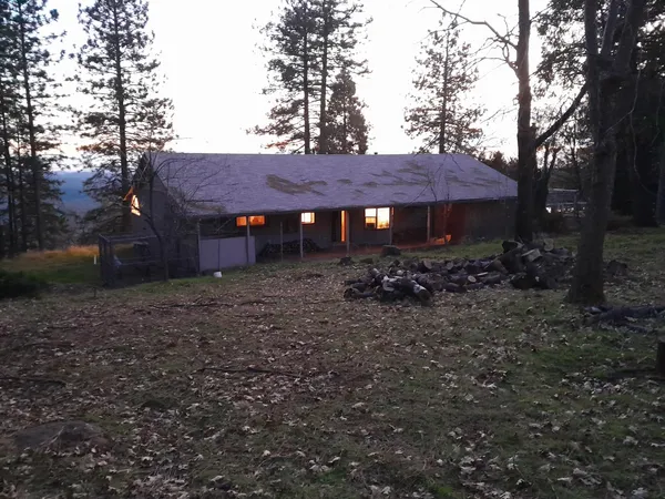 a backyard of a house with lots of green space