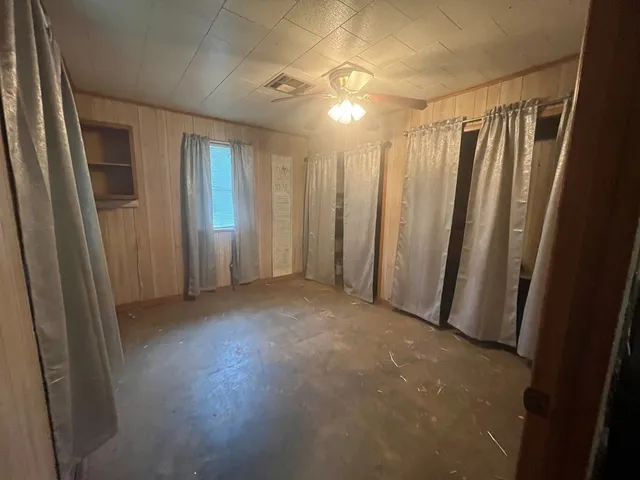 a view of a hallway with carpet